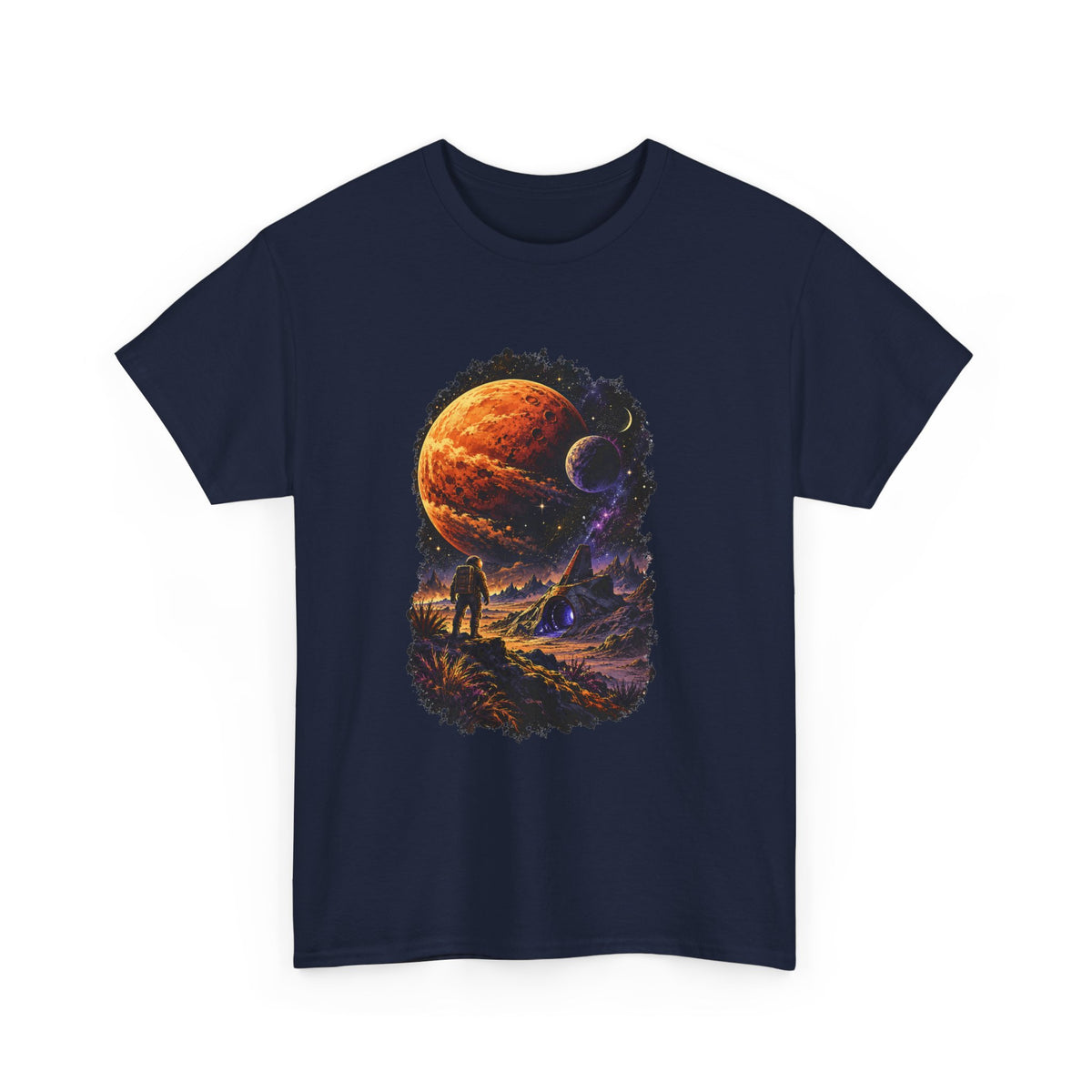 A navy blue short-sleeve crewneck t-shirt featuring a large, detailed graphic print on the front. The graphic depicts a cosmic scene with a large orange planet, smaller celestial bodies, and a silhouetted figure standing on a landscape under a starry sky.