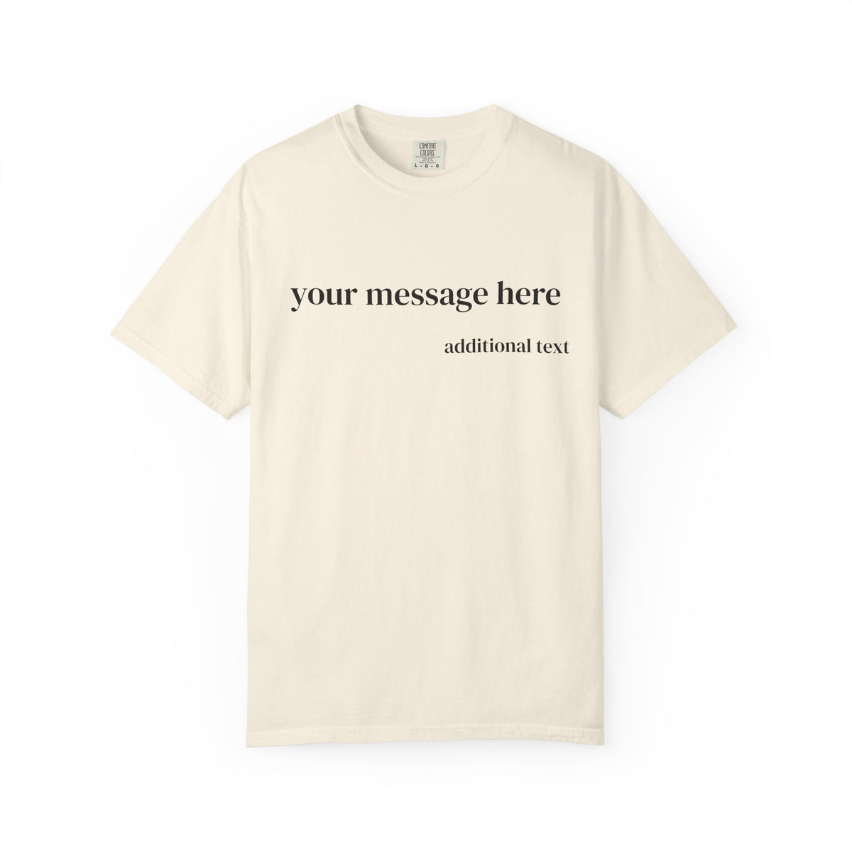 A cream-colored short-sleeve t-shirt with customizable black text on the chest reading 'your message here' and 'additional text' below it, displayed on a clean white background.