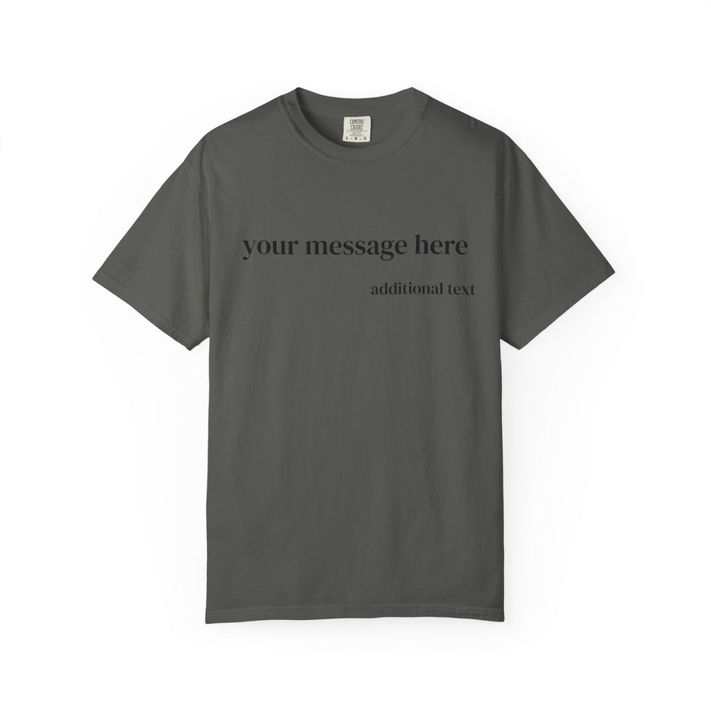 A close-up of a man wearing a dark charcoal gray t-shirt with white placeholder text that reads 'your message here' and 'additional text'.