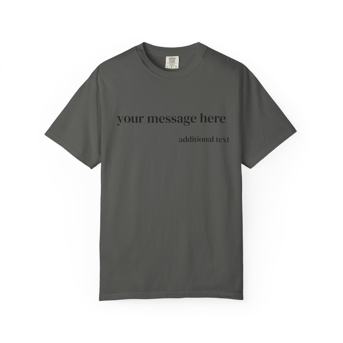 A close-up of a man wearing a dark charcoal gray t-shirt with white placeholder text that reads 'your message here' and 'additional text'.