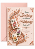 A pink birthday greeting card with an envelope behind it. The card features elegant gold and green text reading 'Happy Birthday to a wonderful Mahjong Friend!' surrounded by 3D floral mahjong tiles, sparkling rhinestone vines, and delicate blossoms.