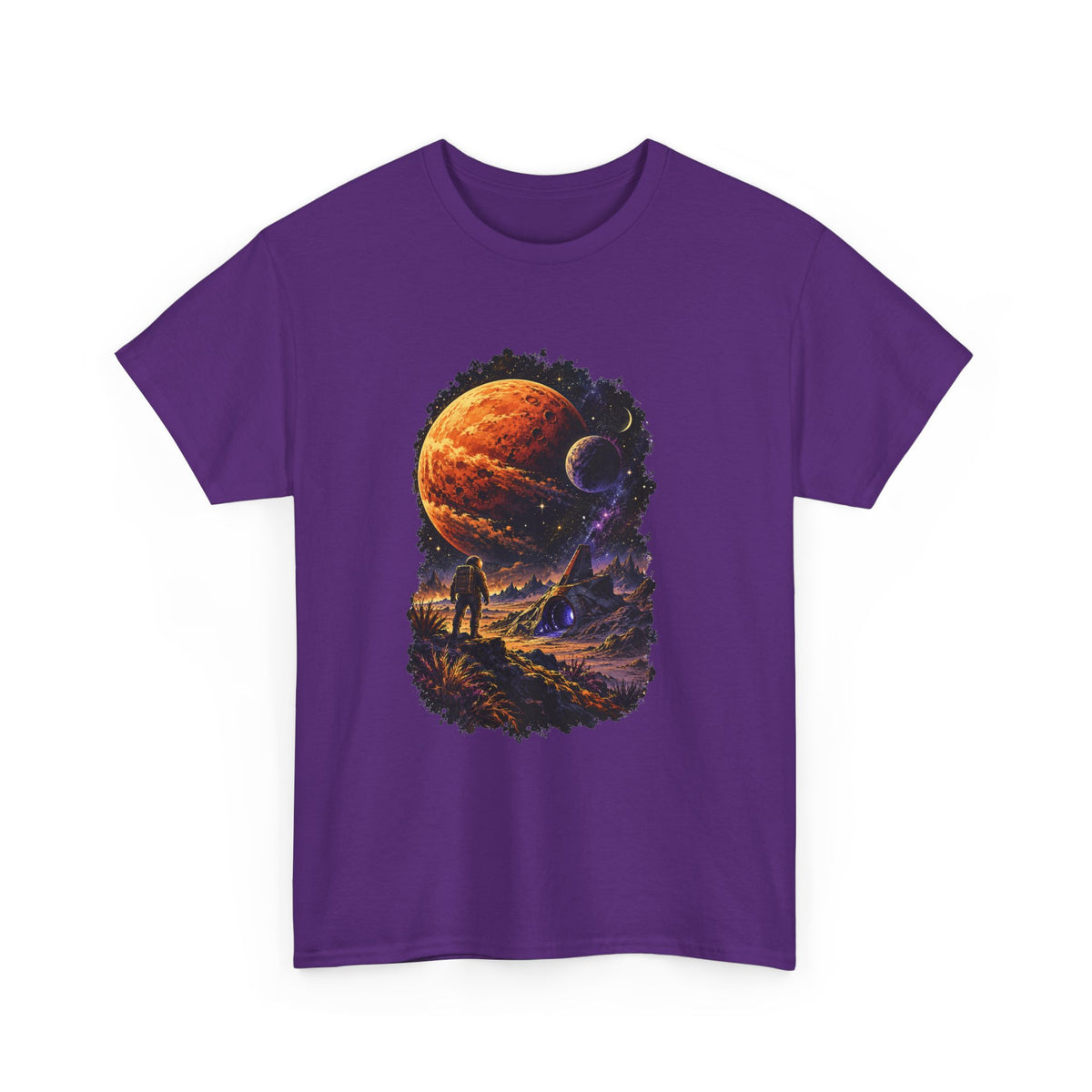 A purple short-sleeve crewneck t-shirt featuring a large, detailed graphic print on the front. The graphic depicts a cosmic scene with a large orange planet, a smaller dark moon, and a silhouetted figure standing in a dramatic landscape under a starry sky.