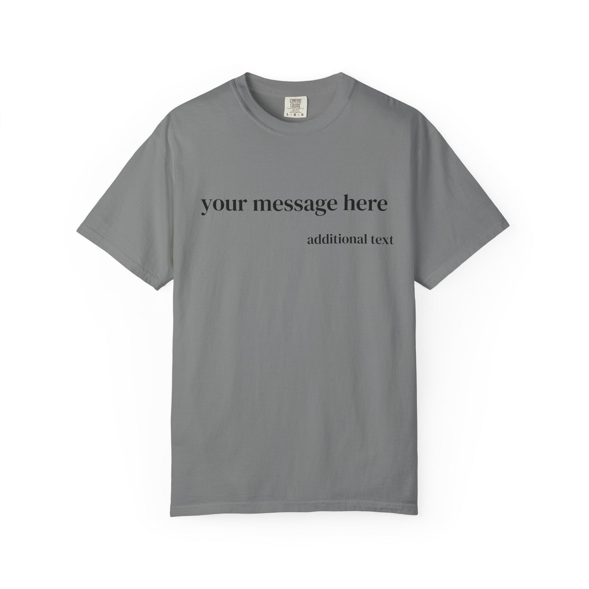 A close-up of a man wearing a dark charcoal gray t-shirt with white placeholder text that reads 'your message here' and 'additional text'.