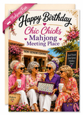 A greeting card with the text 'Happy Birthday Chic Chicks Mahjong Meeting Place' and a printed scene of four women sitting together in a garden-like setting, holding drinks and a mahjong tile box. A pink ribbon says 'MahjongFun' and a beige card backing is visible behind the main printed card.