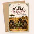 Birthday card with wild animals lion and buffalo playing mahjong, text 'Have a Wildly Fun Birthday!' and envelope.