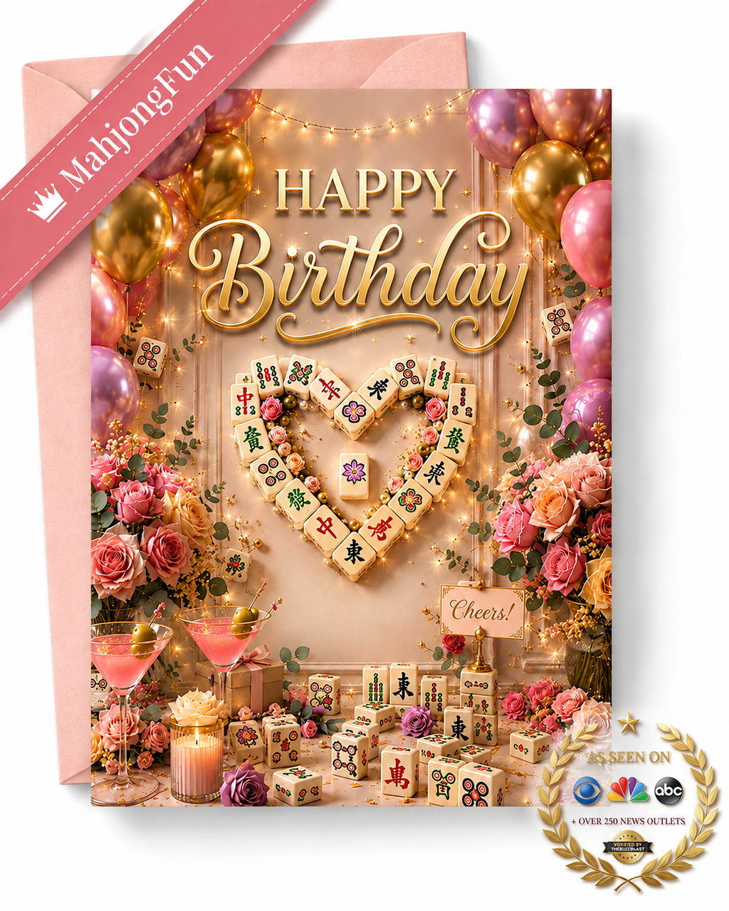 A pink and gold Happy Birthday card featuring a mahjong-themed design with a heart-shaped arrangement of tiles, balloons, flowers, drinks, and candles. A pink envelope is visible behind the card, along with a diagonal 'MahjongFun' ribbon and an 'As Seen On' ABC News style badge in the lower right corner.