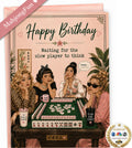 A pink 'Happy Birthday' greeting card featuring an illustration of four women playing mahjong at a table. The card includes a pink 'MahjongFun' banner in the top-left corner and an 'As Seen on NBC' logo in the bottom-right corner.