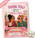 A pink novelty greeting card featuring a cartoon illustration of two women playing mahjong and holding mugs that say 'JOKERS WERE MY BEST FRIEINDS'. The card reads 'THANK YOU! You're ONE IN A MAHJION!' with hearts and game pieces.