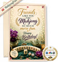 A Mahjong-themed birthday card with a cream envelope behind it, featuring decorative text, purple flowers, teacups, and a mahjong tile arrangement. A diagonal banner reads 'MahjongFun' and a round badge says 'As seen on' with media logos.