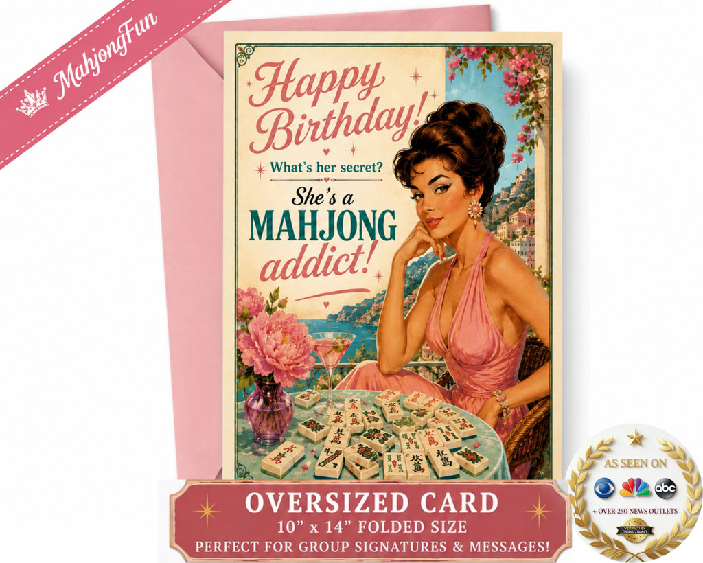 An oversized folded birthday card with a retro 1950s-style illustration of a woman at a mahjong table, shown with a pink envelope on a white background. The card reads 'Happy Birthday! What's her secret? She's a MAHJONG addict!' and includes promotional text and a 'As Seen on ABC' seal.