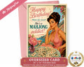 An oversized folded birthday card with a retro 1950s-style illustration of a woman at a mahjong table, shown with a pink envelope on a white background. The card reads 'Happy Birthday! What's her secret? She's a MAHJONG addict!' and includes promotional text and a 'As Seen on ABC' seal.