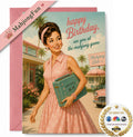 A retro-style birthday greeting card featuring a vintage illustration of a woman in a pink dress holding a mahjong set, with the text 'happy Birthday, see you at the mahjong game.' A pink envelope is placed behind the card, and a diagonal 'MahjongFun' ribbon and a 'As Seen On' badge are overlaid as promotional graphics.