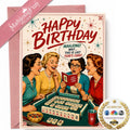 A retro-style mahjong-themed birthday card with a pink envelope, featuring vintage illustrations of four women playing mahjong and bold red 'HAPPY BIRTHDAY' text. A pink 'MahjongFun REVIEW' ribbon appears in the top left, and an 'AS SEEN ON' media badge is in the bottom right.