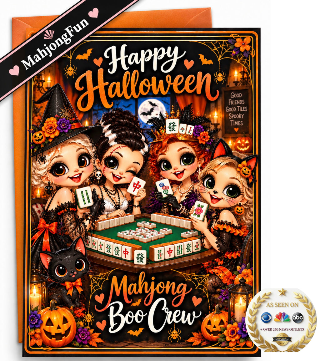 A Halloween-themed mahjong card set featuring a colorful illustrated card with four cartoon witches playing mahjong, surrounded by pumpkins, spiders, candles, and the text 'Happy Halloween' and 'Mahjong and Boo Crew'. An orange envelope is visible behind the card, with a black diagonal banner reading 'MahjongFun' and a round 'As Seen on NBC' style seal in the lower right corner.