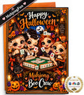 A Halloween-themed mahjong card set featuring a colorful illustrated card with four cartoon witches playing mahjong, surrounded by pumpkins, spiders, candles, and the text 'Happy Halloween' and 'Mahjong and Boo Crew'. An orange envelope is visible behind the card, with a black diagonal banner reading 'MahjongFun' and a round 'As Seen on NBC' style seal in the lower right corner.
