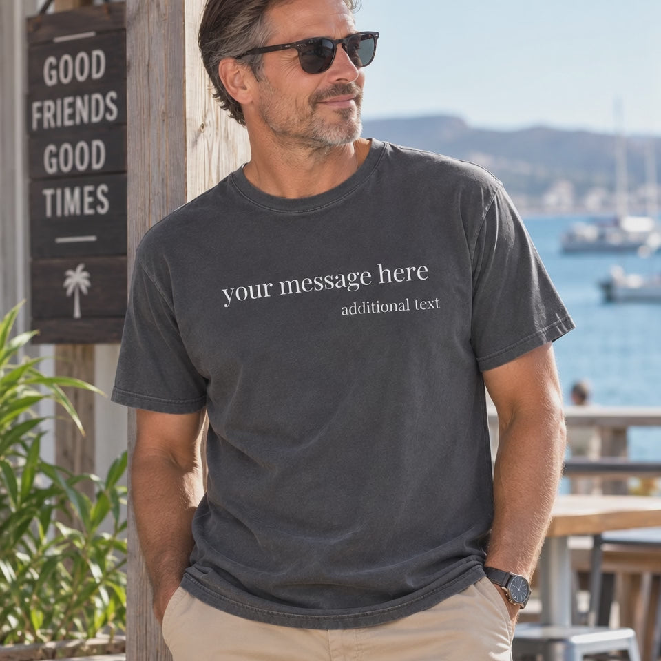 A close-up of a man wearing a dark charcoal gray t-shirt with white placeholder text that reads 'your message here' and 'additional text'.